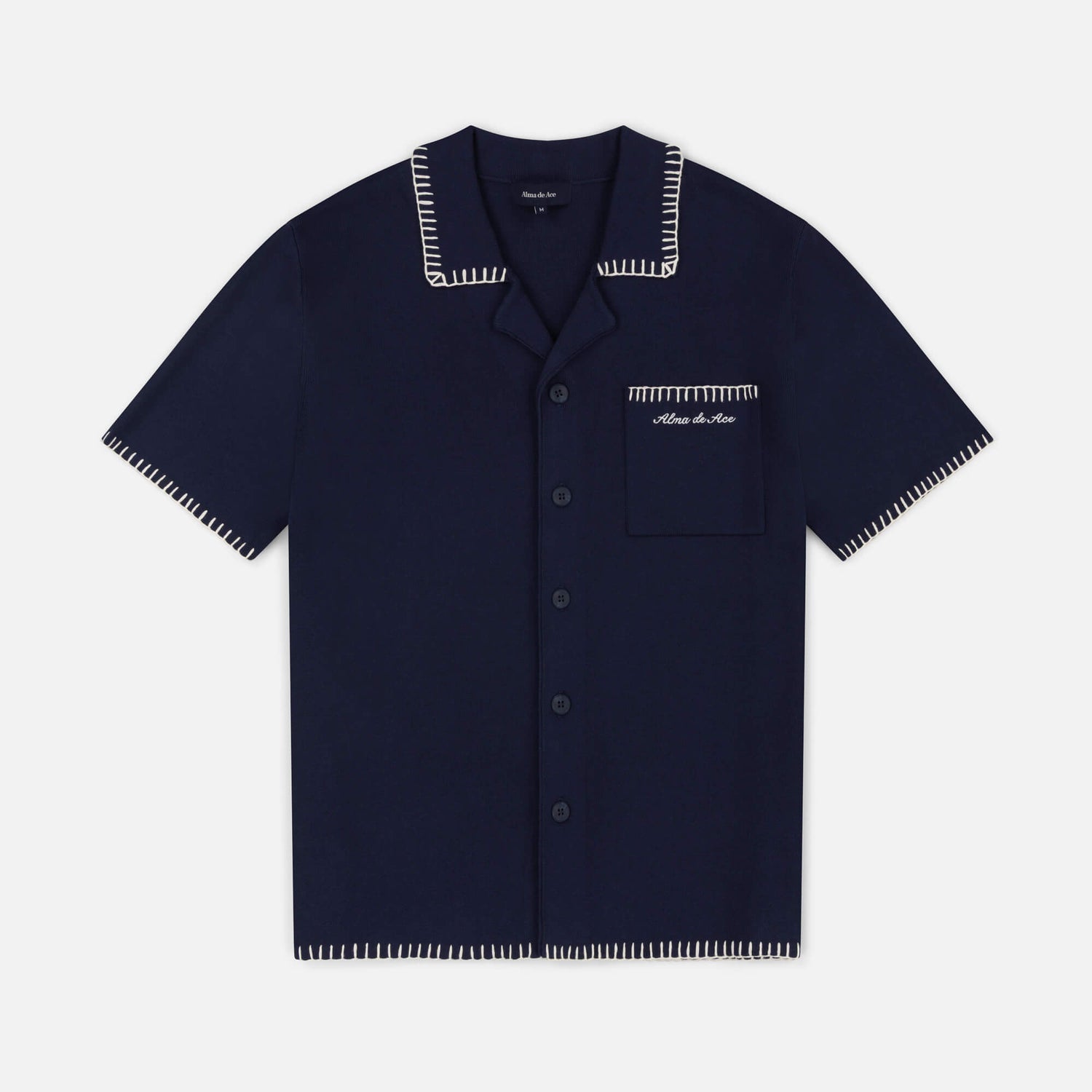 Navy blue shirt with white trim on a light gray background